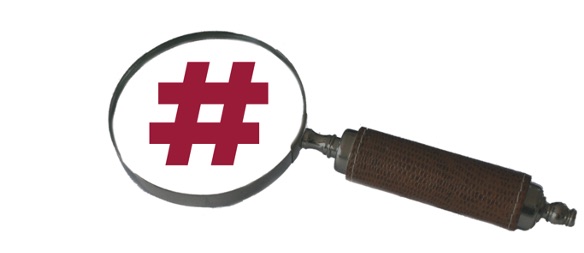 Magnifying glass revealing a vibrant branded hashtag symbol in brand colour on a white background - Your essential guide for mastering social media.